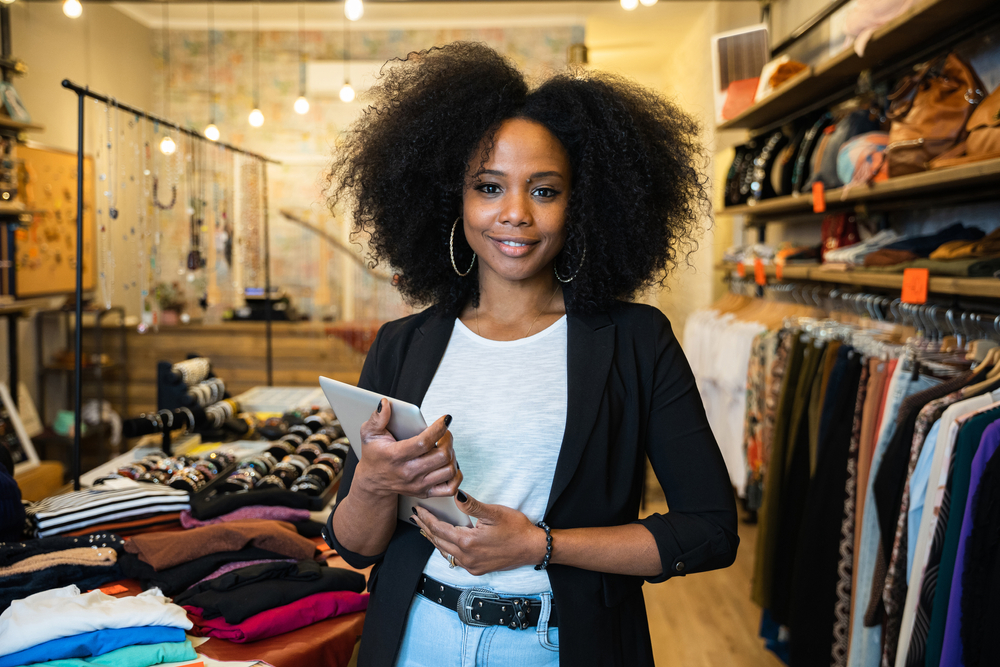 Portrait,of,the,owner,of,a,clothing,store,at,the