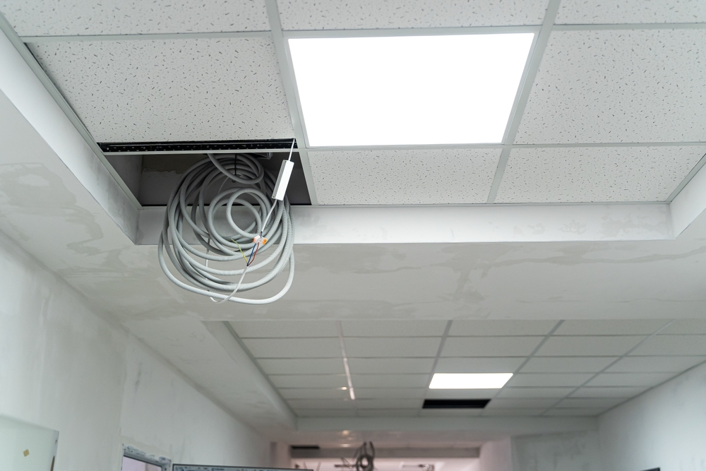 Exposed,ceiling,with,wires,during,renovation,in,a,commercial,space.