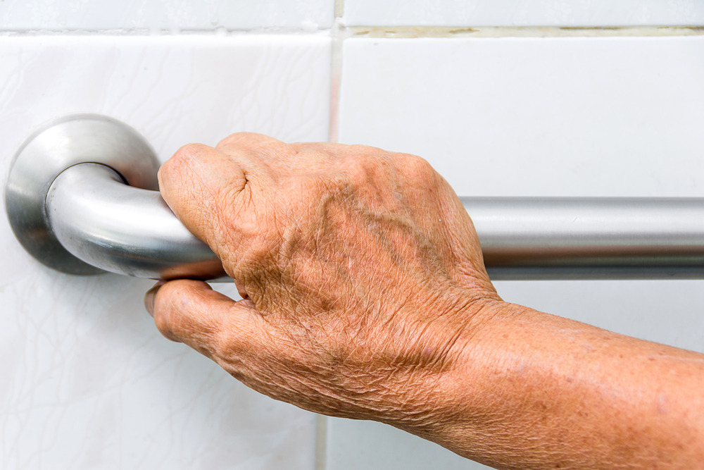 Elderly,holding,a,grab,bars,in,a,bathroom