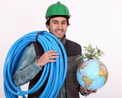 Construction,worker,holding,corrugated,tubing,and,a,globe