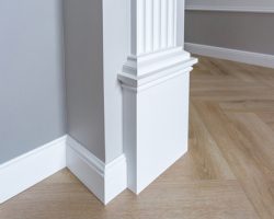 Detail,of,corner,flooring,with,intricate,crown,molding.